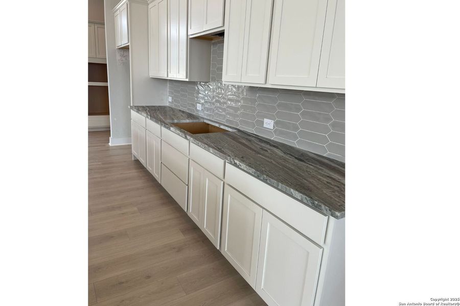Furnished interior view inside a new home in Potranco Oaks, Castroville (Image 15).