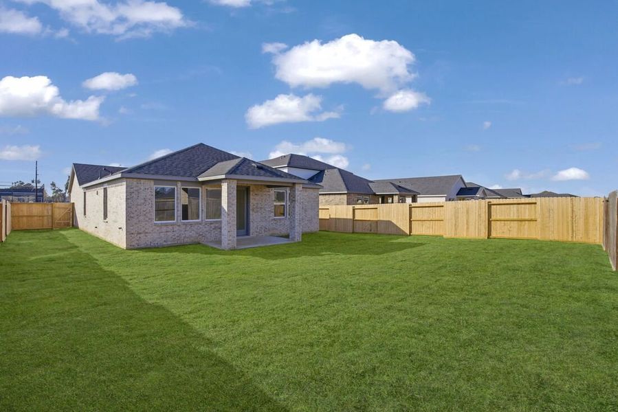 Exterior details and patio area of a home in Raburn Reserve 50s, Tomball (Image 3).
