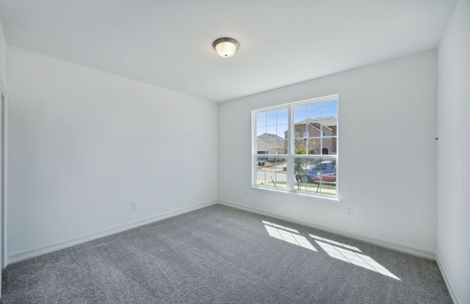 Spacious secondary bedroom with large windows