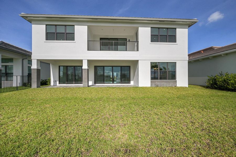 Front exterior of a new home in Apex at Avenir, Palm Beach Gardens, FL, highlighting curb appeal (Image 29).