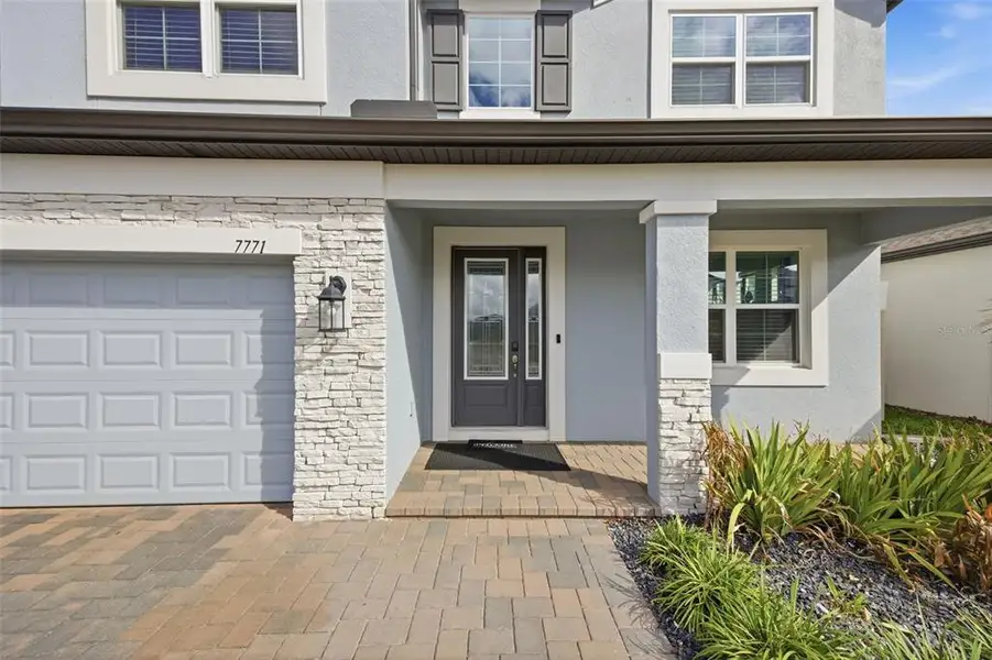 Exterior details and patio area of a home in Whispering Oaks Preserve, Wesley Chapel (Image 33). Exterior details and patio area of a home in Whispering Oaks Preserve, Wesley Chapel (Image 33).