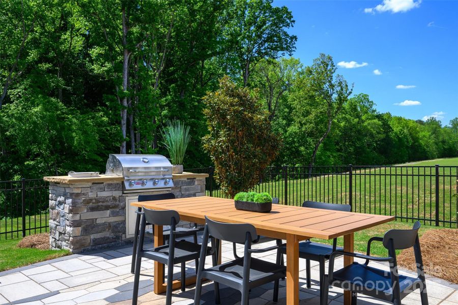 Exterior details and patio area of a home in North Creek Village, Huntersville (Image 4).
