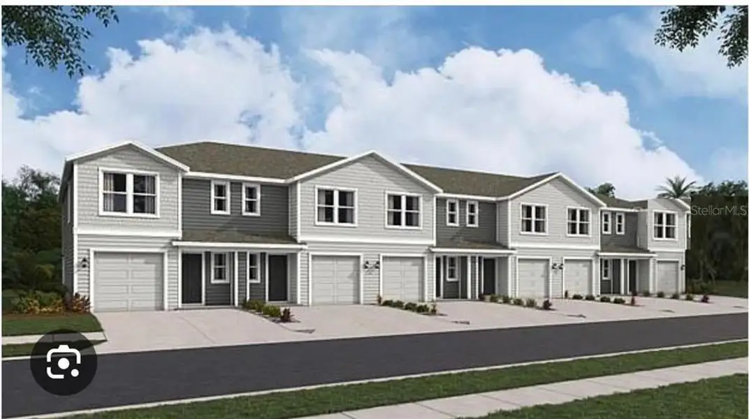 Front exterior of a new home in The Towns at Laurel Commons, Ocala, FL, highlighting curb appeal (Image 1).