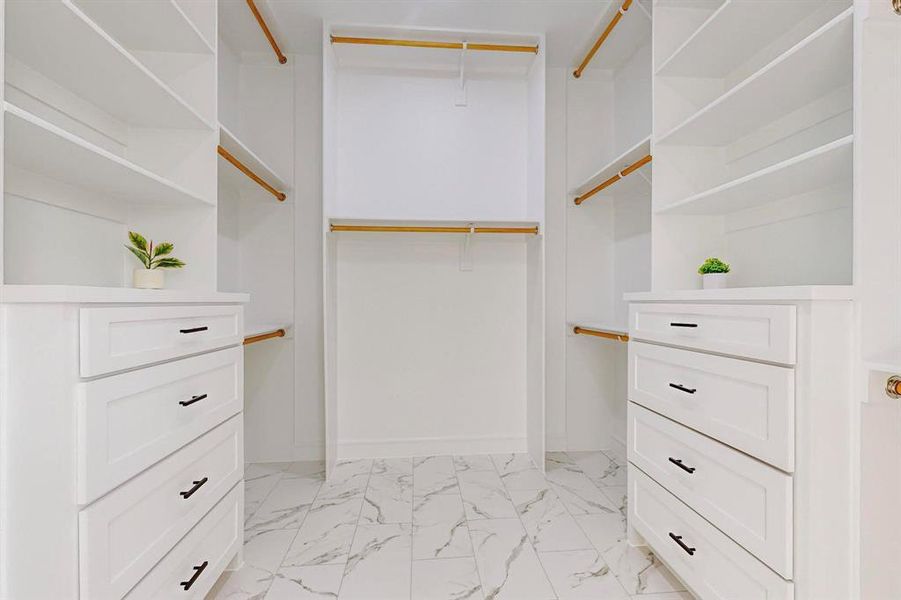 Main Walk in closet with light tile patterned floors