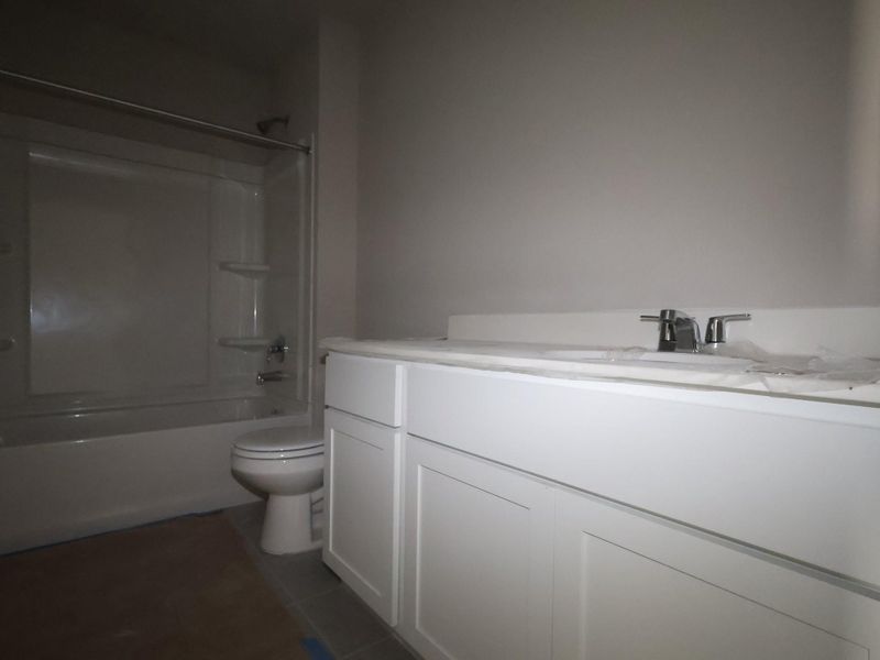 In-progress construction of a new home in Carillon, Manor, TX (Image 8).