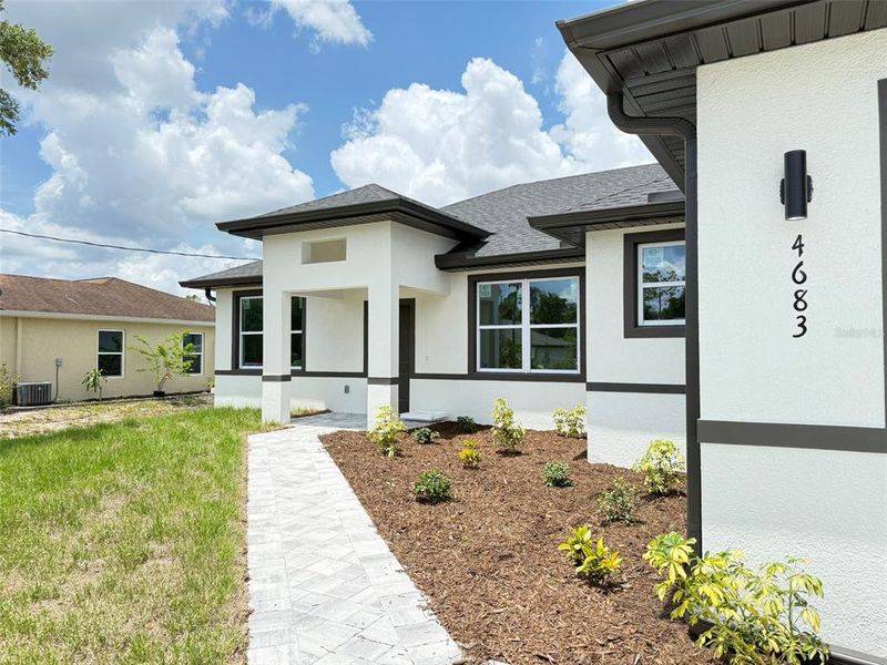 Front exterior of a new home in , North Port, FL, highlighting curb appeal (Image 13).