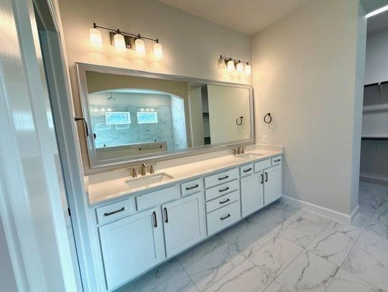 Quartz counters and dual sinks at spacious Master bath