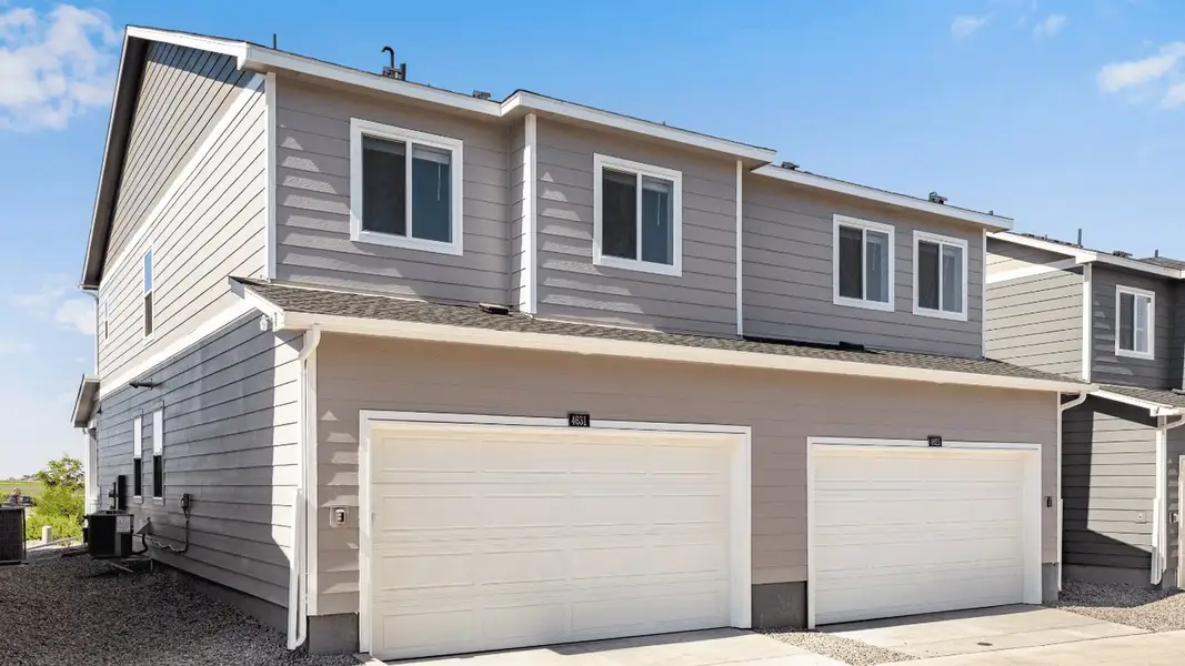Front exterior of a new home in Villas at Vantage, Berthoud, CO, highlighting curb appeal (Image 17).