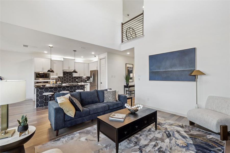 Living room with light hardwood / wood-style flooring