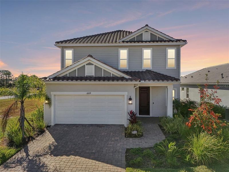 Front exterior of a new home in , Sarasota, FL, highlighting curb appeal (Image 29). Front exterior of a new home in , Sarasota, FL, highlighting curb appeal (Image 29).