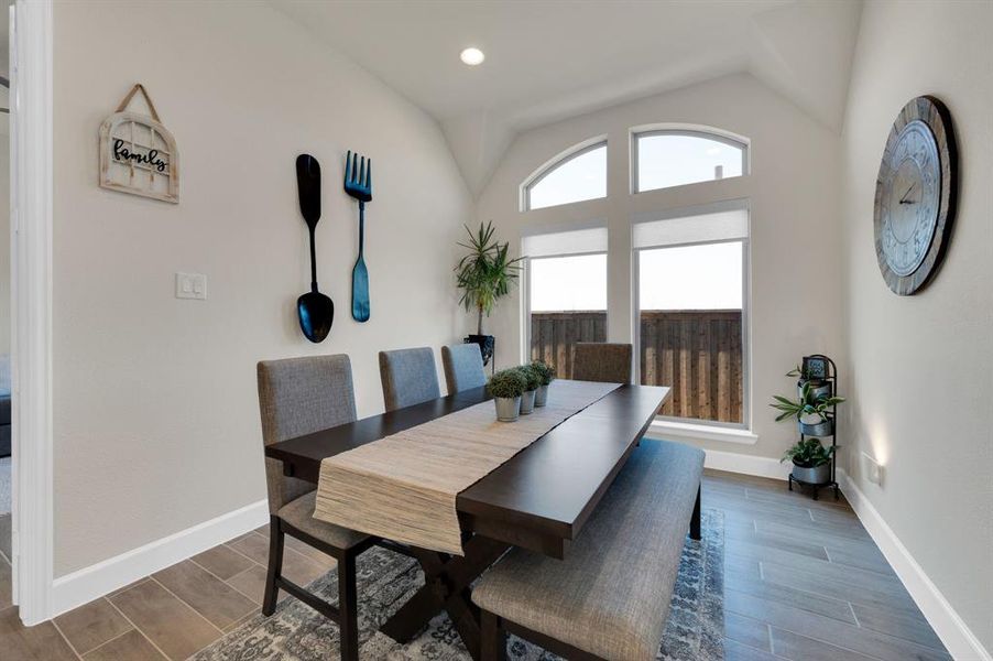 Large 16' x 10 Morning Room with tons of natural light even if the custom roller shades are down due to the arched transom windows up top