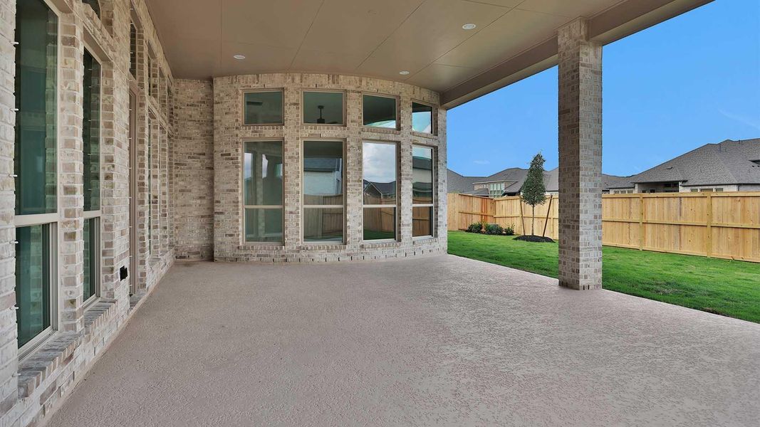 Exterior details and patio area of a home in Meridiana, Manvel (Image 2).