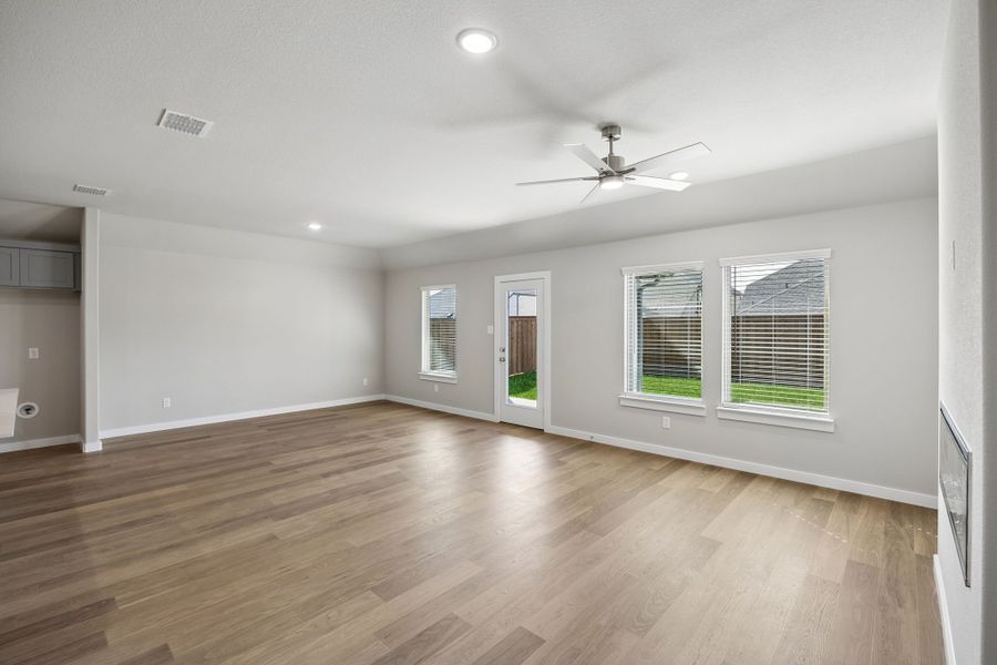 Living and Dining in the Emmy II home plan by Trophy Signature Homes - REPRESENTATIVE PHOTO