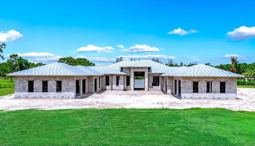 Front exterior of a new home in , Lake Worth, FL, highlighting curb appeal (Image 2). Front exterior of a new home in , Lake Worth, FL, highlighting curb appeal (Image 2).