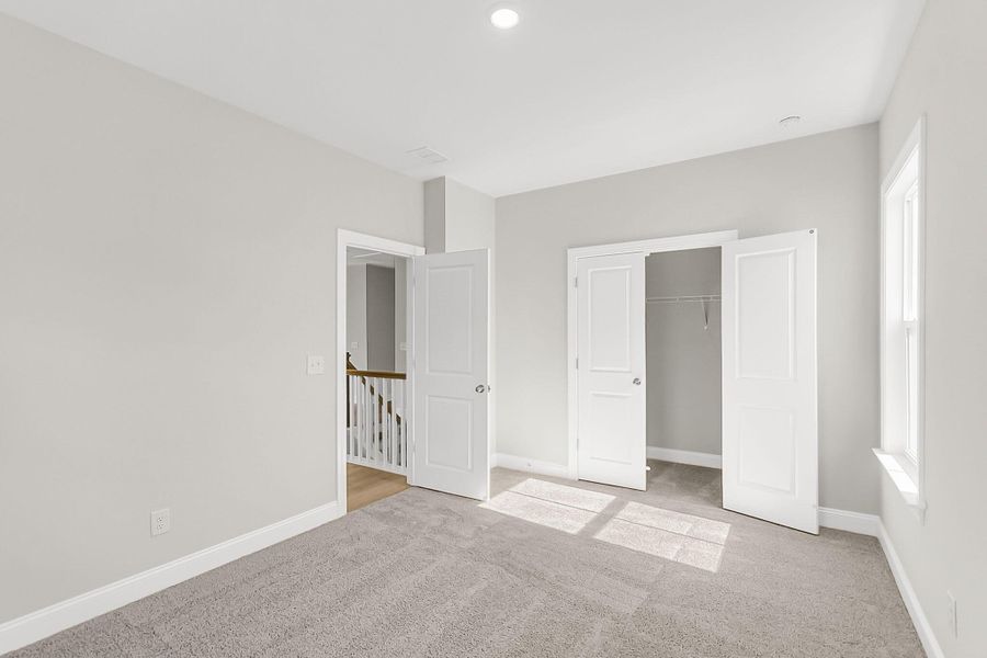 Spacious, unfurnished interior of a new home in Tidewater at Lakes of Cane Bay, Summerville (Image 42).