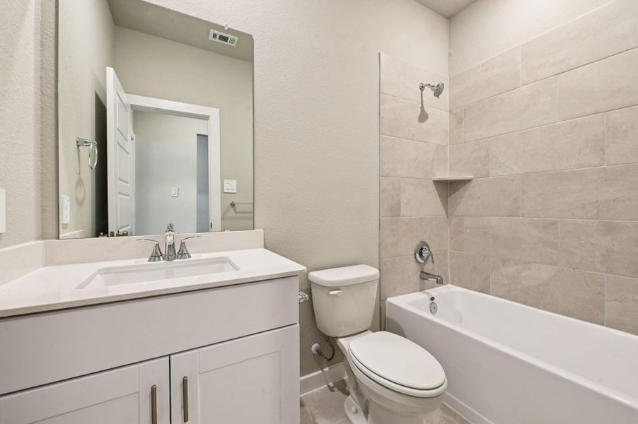 Furnished interior view inside a new home in Heights of Barbers Hill, Mont Belvieu (Image 11).