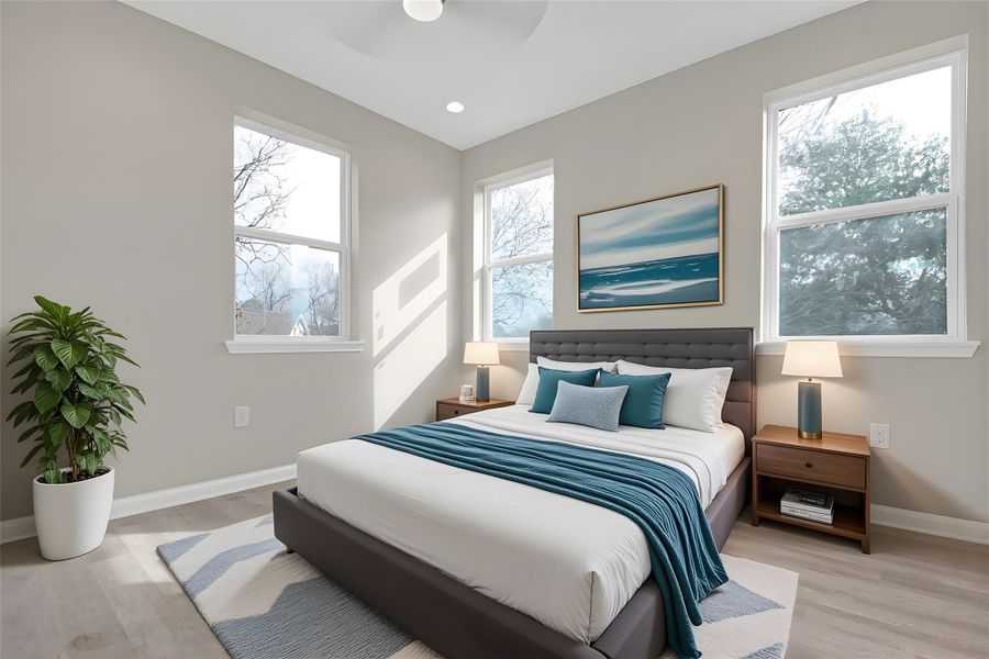 Bedroom with light wood-type flooring, ceiling fan, and recessed lighting