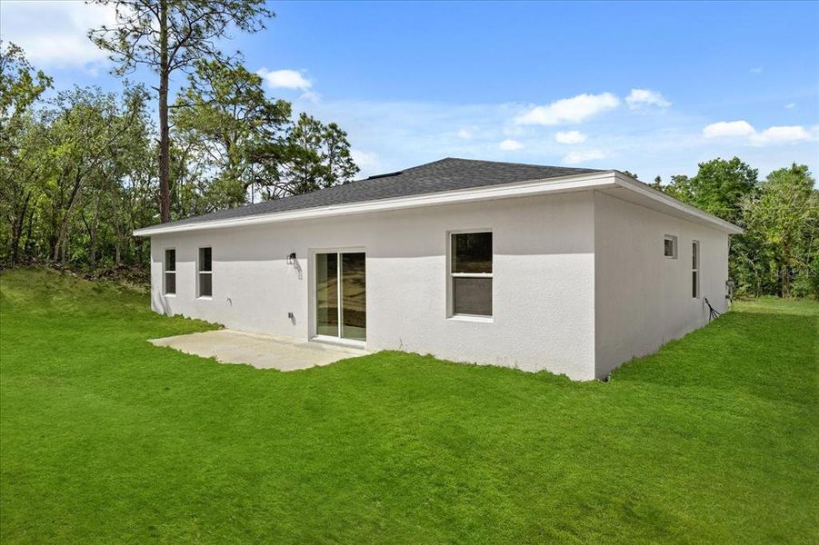 Front exterior of a new home in , Dunnellon, FL, highlighting curb appeal (Image 1).
