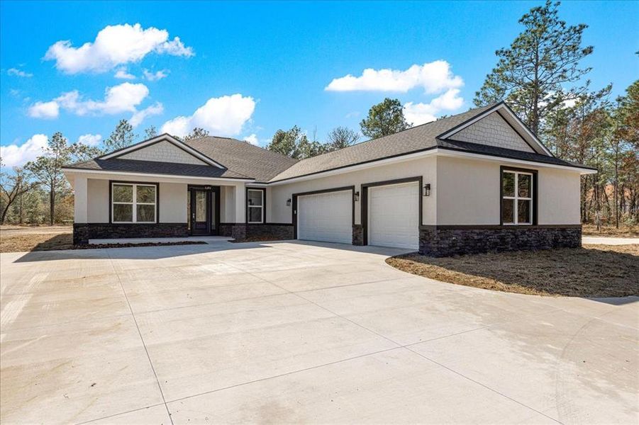 Front exterior of a new home in , Dunnellon, FL, highlighting curb appeal (Image 29).