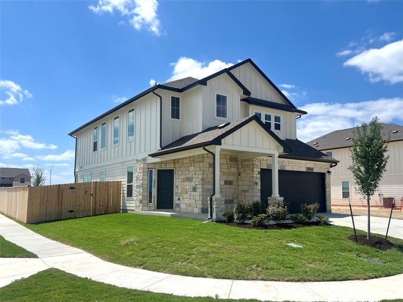 Front exterior of a new home in Porter Country, Buda, TX, highlighting curb appeal (Image 2).