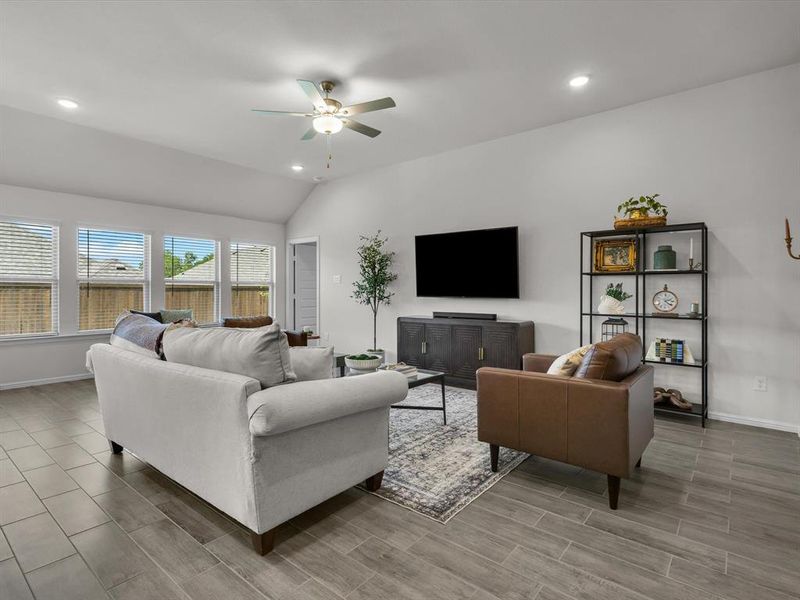 The entry opens into a light-filled and expansive open-concept living space,
where the living room, kitchen, and dining area blend seamlessly.