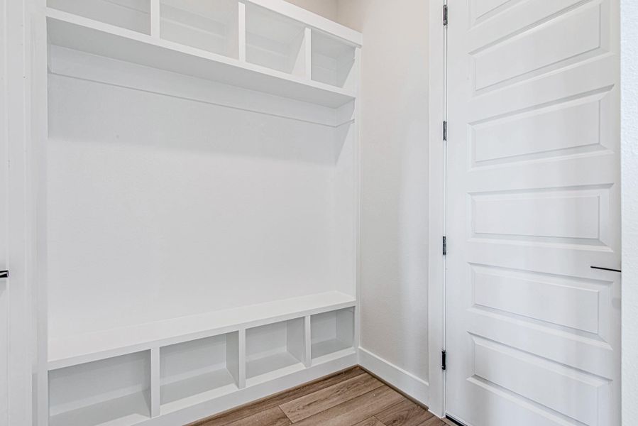 Custom mudroom with built-in storage, providing convenience and organization.