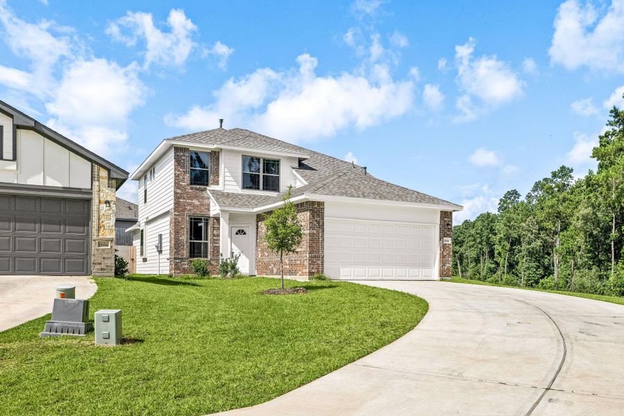 Front exterior of a new home in Magnolia Springs, Montgomery, TX, highlighting curb appeal (Image 2). Front exterior of a new home in Magnolia Springs, Montgomery, TX, highlighting curb appeal (Image 2).