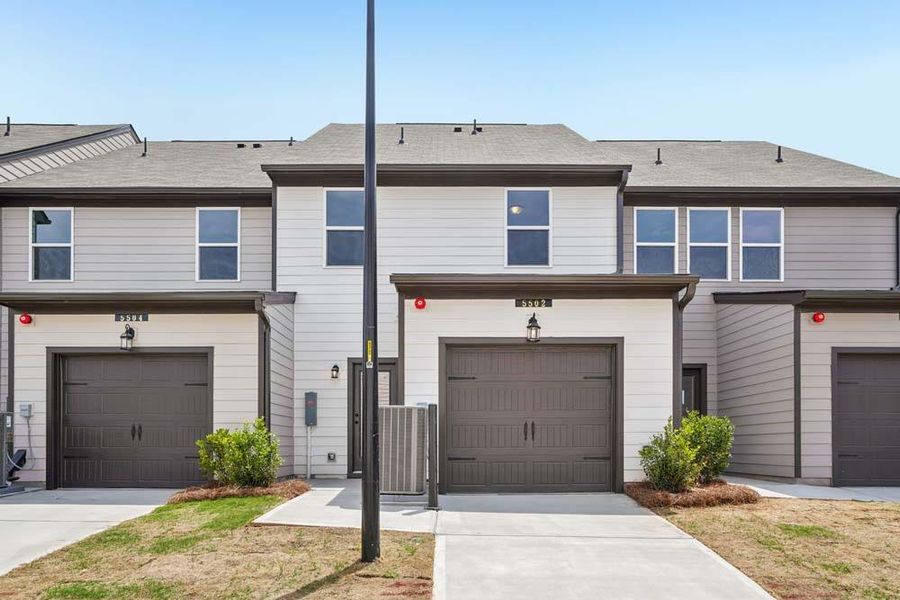 Front exterior of a new home in Laurelwood, Douglasville, GA, highlighting curb appeal (Image 19). Front exterior of a new home in Laurelwood, Douglasville, GA, highlighting curb appeal (Image 19).