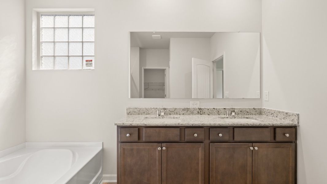 Representative furnished interior of a home built from the Cali by D.R. Horton in South Wind, South Fulton (Image 11).