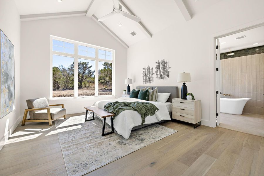 Bedroom with high vaulted ceiling, light wood-type flooring, visible vents, and beamed ceiling