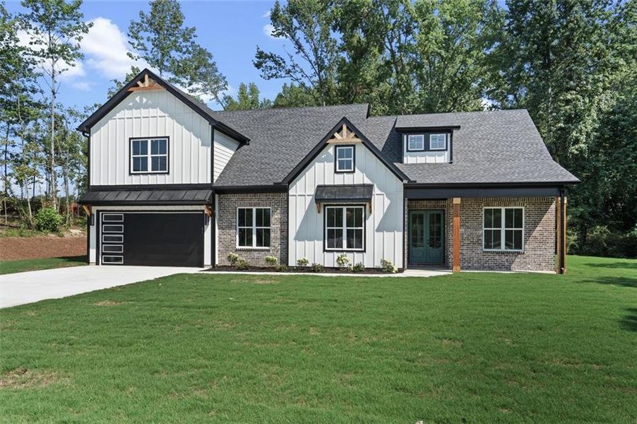 Front exterior of a new home in , Powder Springs, GA, highlighting curb appeal (Image 23). Front exterior of a new home in , Powder Springs, GA, highlighting curb appeal (Image 23).