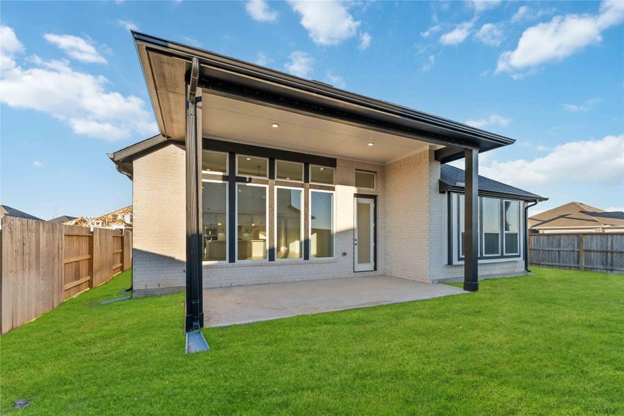 Exterior details and patio area of a home in Arabella on the Prairie, Booth (Image 3).