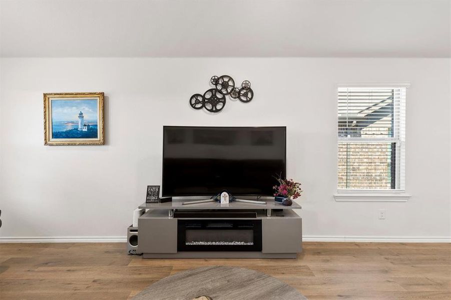 Living room with light wood-type flooring and baseboards Living room with light wood-type flooring and baseboards