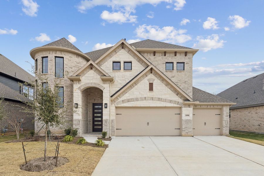 Front exterior of a new home in Timberbrook, Justin, TX, highlighting curb appeal (Image 1). Front exterior of a new home in Timberbrook, Justin, TX, highlighting curb appeal (Image 1).