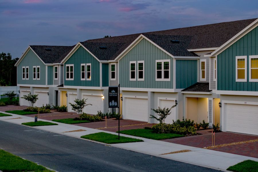 Front exterior of a new home in Blue Springs Reserve Townhomes, Groveland, FL, highlighting curb appeal (Image 13).