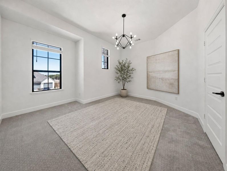 A well-lit bedroom features plush carpeting and a striking modern chandelier, ready for personalization. A well-lit bedroom features plush carpeting and a striking modern chandelier, ready for personalization.