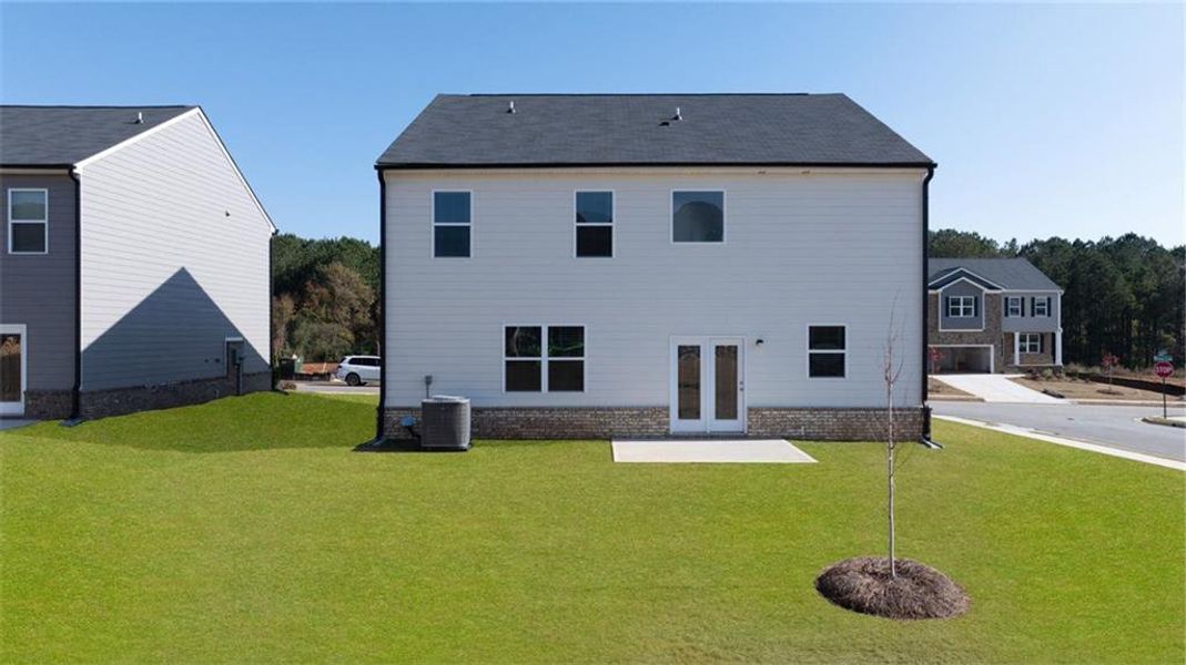 Front exterior of a new home in The Reserve at Calcutta, Stockbridge, GA, highlighting curb appeal (Image 18). Front exterior of a new home in The Reserve at Calcutta, Stockbridge, GA, highlighting curb appeal (Image 18).