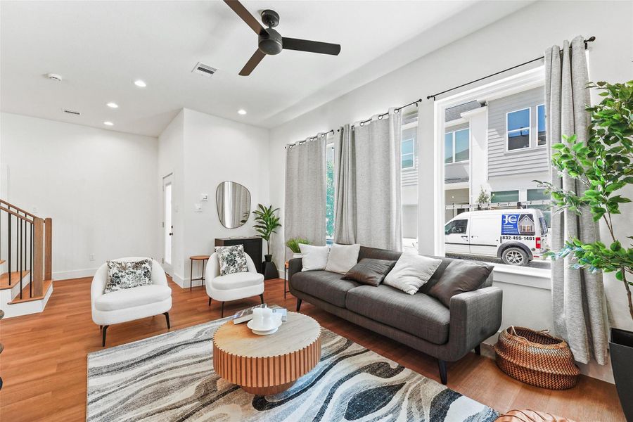 Open-concept living with 10-ft ceilings, large Low-E windows, modern kitchen, and elegant vinyl wood flooring throughout. Open-concept living with 10-ft ceilings, large Low-E windows, modern kitchen, and elegant vinyl wood flooring throughout.