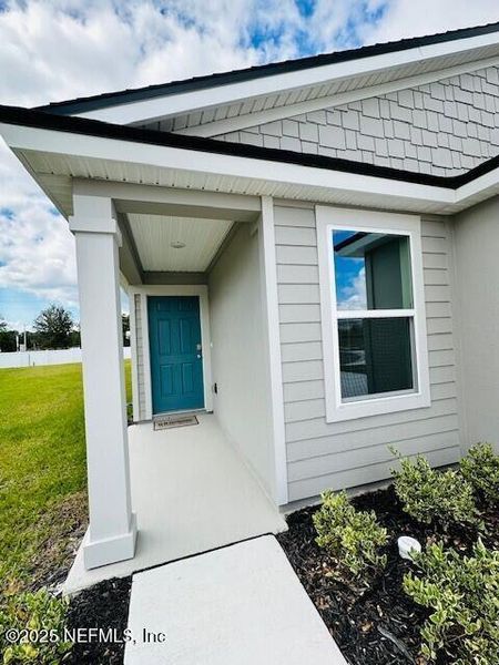 Exterior details and patio area of a home in Rookery, Green Cove Springs (Image 4).