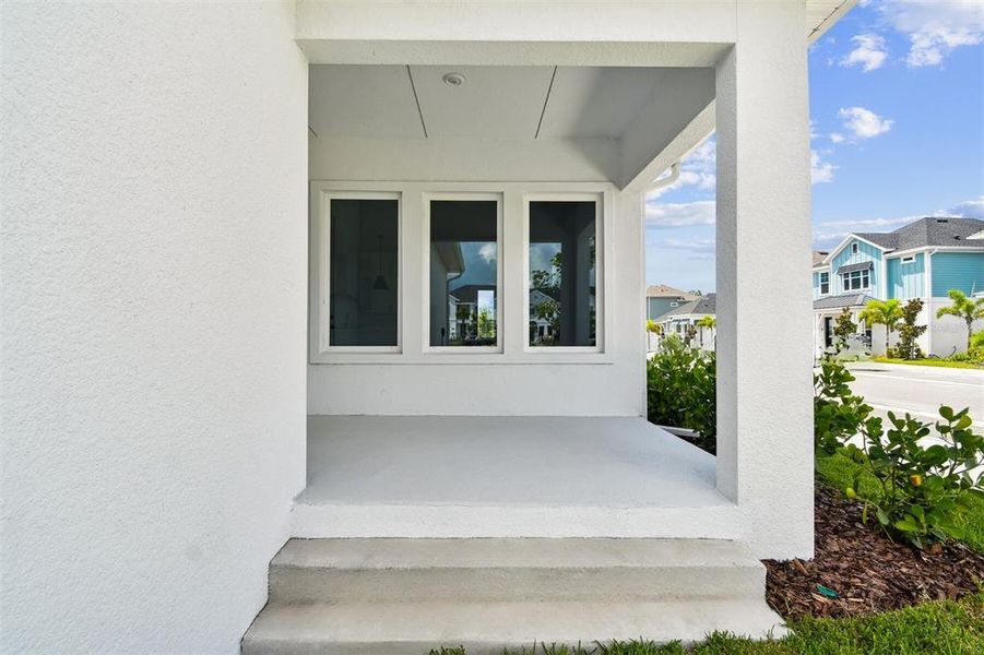 Exterior details and patio area of a home in Emerald Landing at Waterside at Lakewood Ranch – Cottage Series, Sarasota (Image 2).