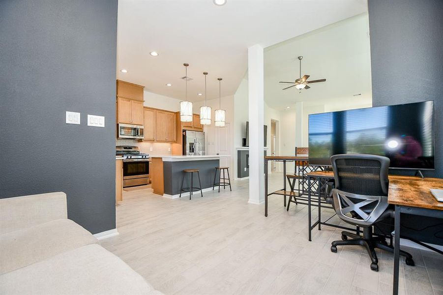 This casual dining area is perfect for gathering with family and friends, featuring wood-look tile flooring, designer paint, and ample space for your breakfast table and sideboard.