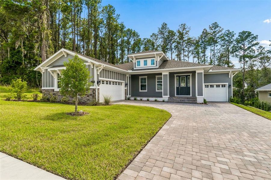 Front exterior of a new home in Southern Hills Plantation, Brooksville, FL, highlighting curb appeal (Image 27). Front exterior of a new home in Southern Hills Plantation, Brooksville, FL, highlighting curb appeal (Image 27).