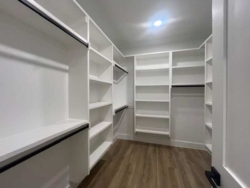 Custom closet system featuring extensive shelving and hanging rods Custom closet system featuring extensive shelving and hanging rods