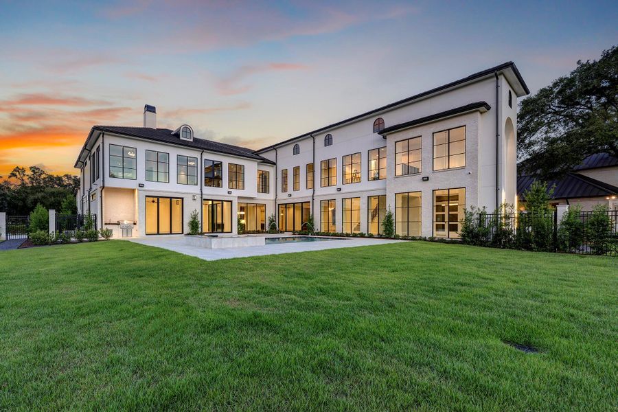 Exterior of house featuring large yard, pool and BBQ area. Exterior of house featuring large yard, pool and BBQ area.