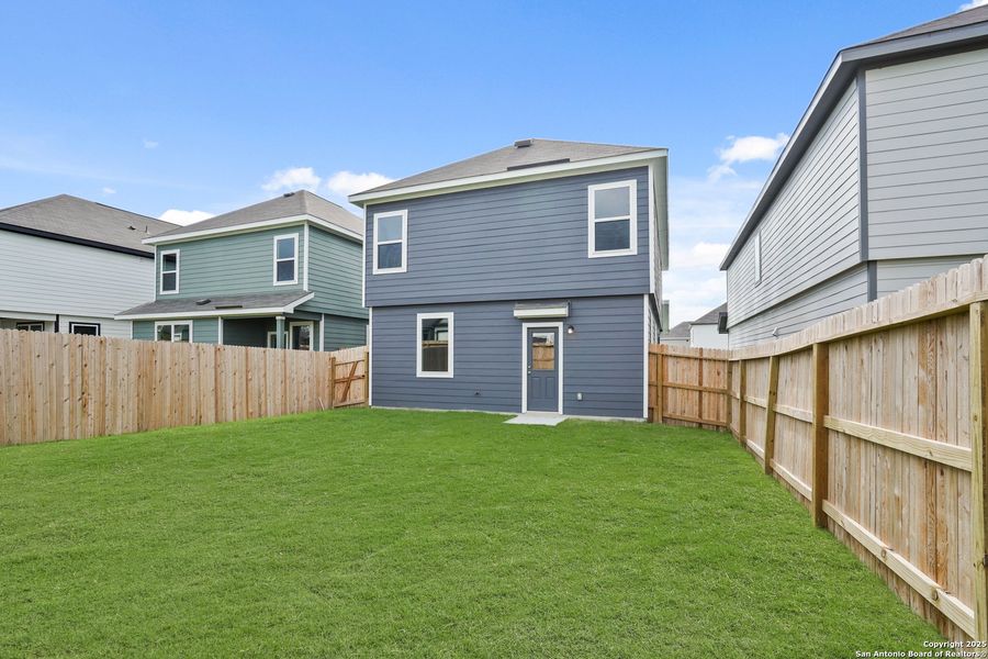 Front exterior of a new home in Melissa Ranch, San Antonio, TX, highlighting curb appeal (Image 2).