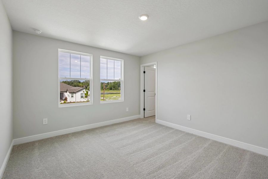 Bedroom 2 is located off the front of the home and features a walk-in shower
