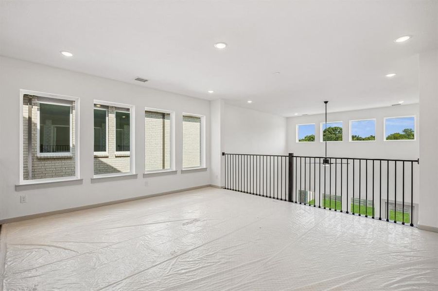 Spacious and bright, this game room offers endless family fun time!