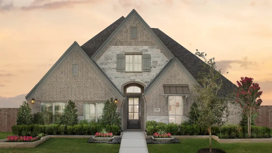 Representative exterior photo of a completed home built from the 2916W by Perry Homes in Veramendi, New Braunfels, TX (Image 21).