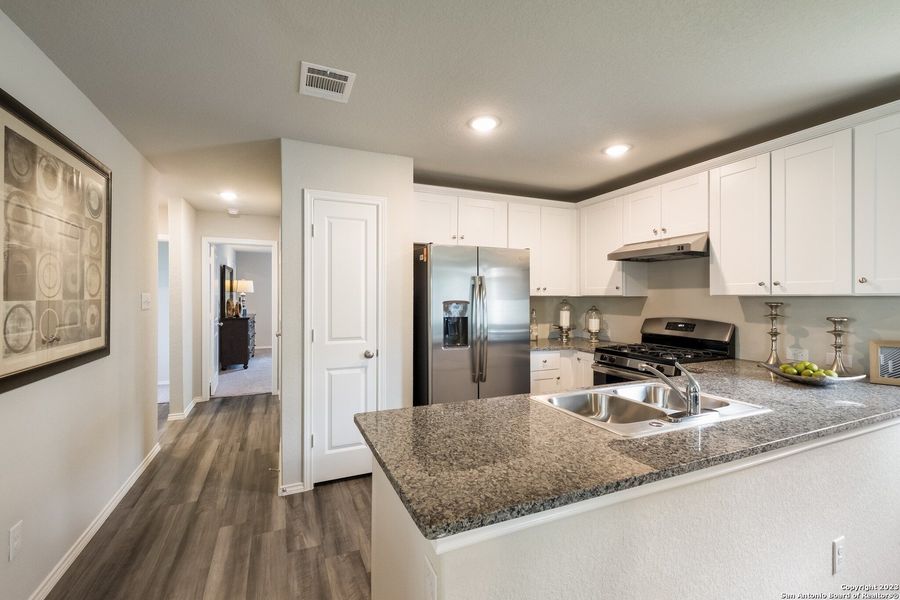 Furnished interior view inside a new home in Navarro Ranch: Cottage Collection, Seguin (Image 10). Furnished interior view inside a new home in Navarro Ranch: Cottage Collection, Seguin (Image 10).