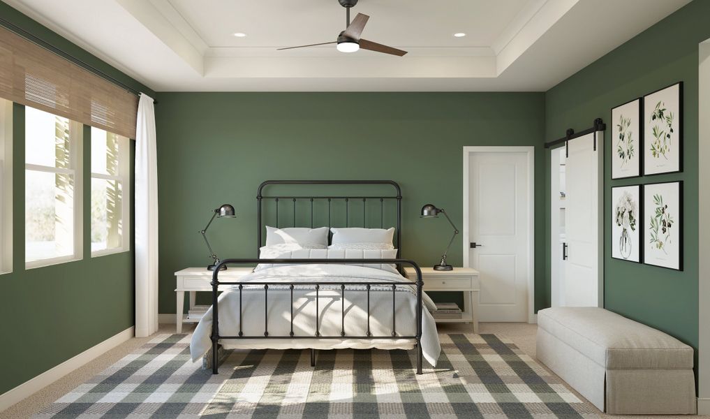 Primary suite with crown moulding and plush carpeting